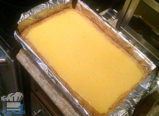 The second layer of the Peanut Cheese Bars have been cooked and are left to cool before slicing into them. 