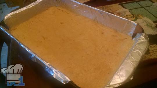 First layer of the Peanut Cheese Bar has been baked and is left to cool.