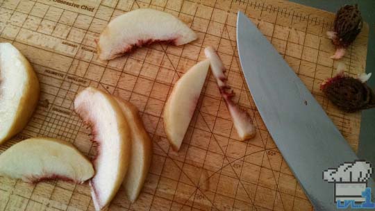 Sliced peaches ready to be assembled in the tart dough before baking.