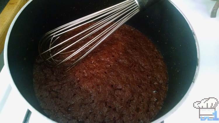 Cooking sugar in pot before adding brown butter to mix.