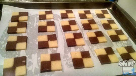 Sliced checkerboard cookies on pan and ready to be baked off.