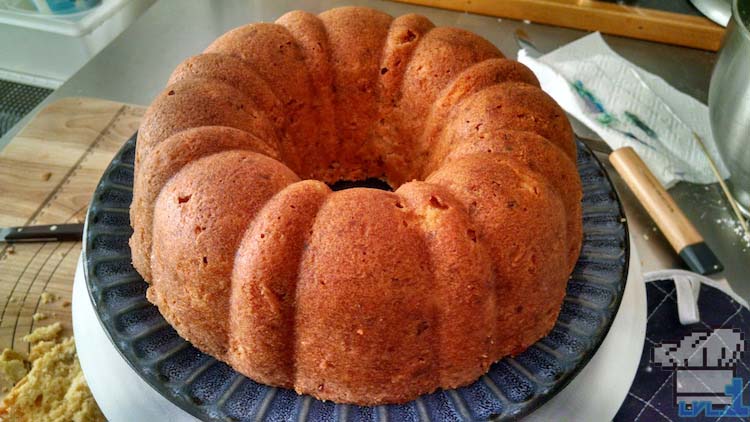 The finished bundt cake removed from the pan and placed on a plate.