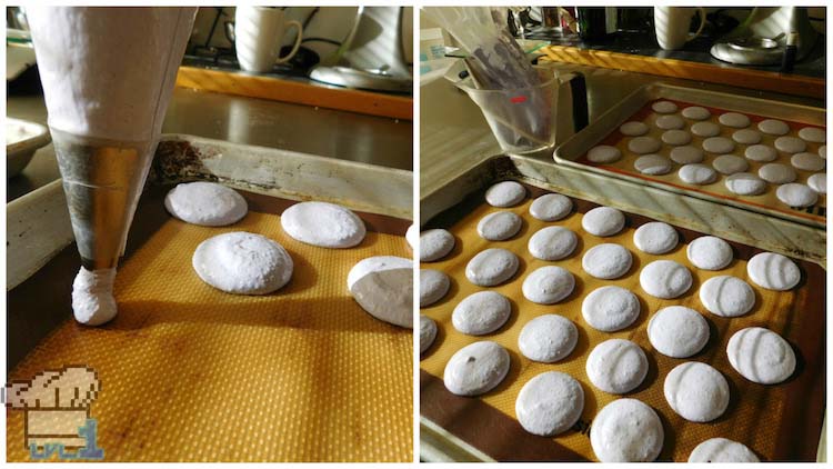 Piping macaron Glamburger buns from pastry piping bag onto sheet tray before baking.