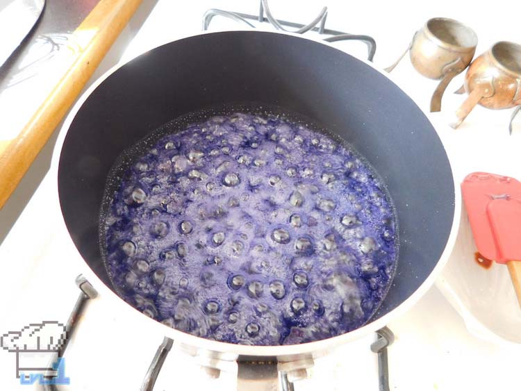 Cooking the sugar with the purple food coloring to make the Italian meringue base for the Glamburger macaron buns. 