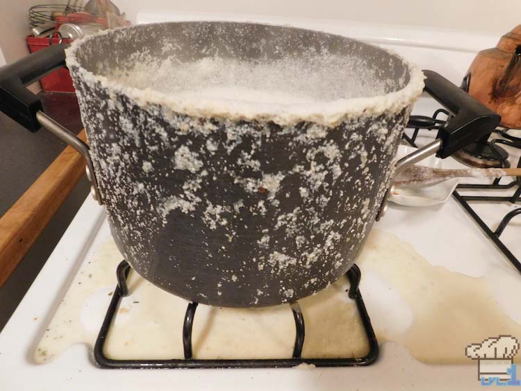 The soybean mixture has boiled over the pot and caused a huge mess on the stove!