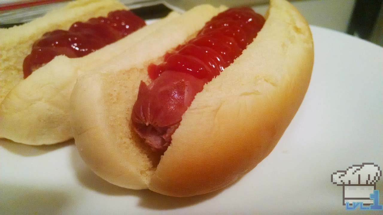 A hot dog in bun with cat ears cut into the end of it, with ketchup on top, as a joke Hot Cat recipe from the Undertale game series.