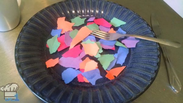 Torn up pieces of colorful construction paper on a plate as a joke Temflakes recipe from the Undertale game series.