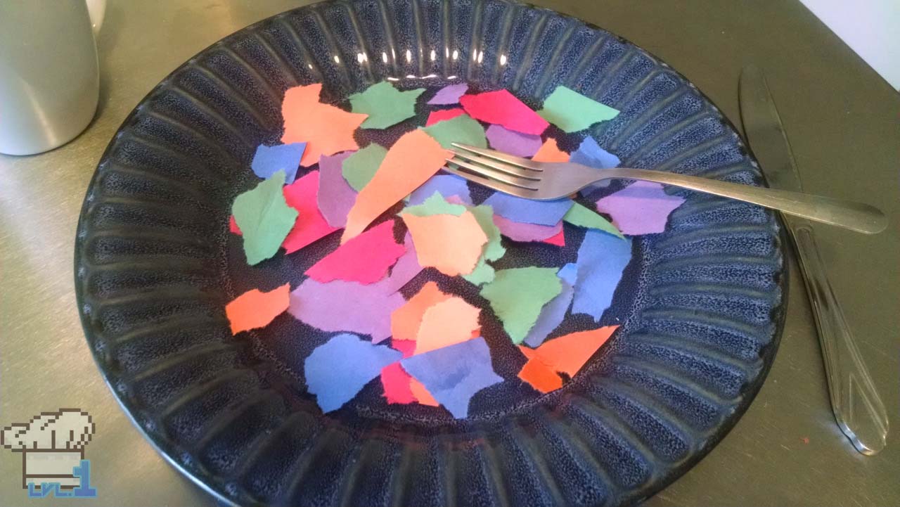 Torn up pieces of colorful construction paper on a plate as a joke Temflakes recipe from the Undertale game series.