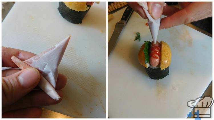Piping ketchup onto the hot dog sushi tops for garnish and flavor.