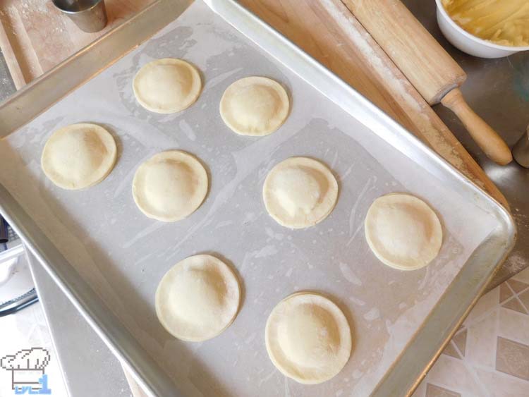 Sealed Lumiose Galette pockets resting on baking tray before being bake in oven.