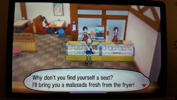 A screenshot from the Pokemon game series of a malasada clerk offering to bring the fresh fried malasada table side.