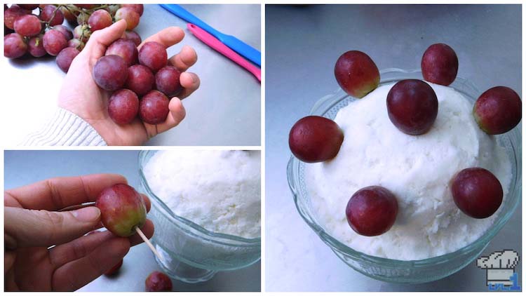 Spearing the grapes with toothpicks and sticking them into the dome of the ice cream snow Couple's Cake for garnish.