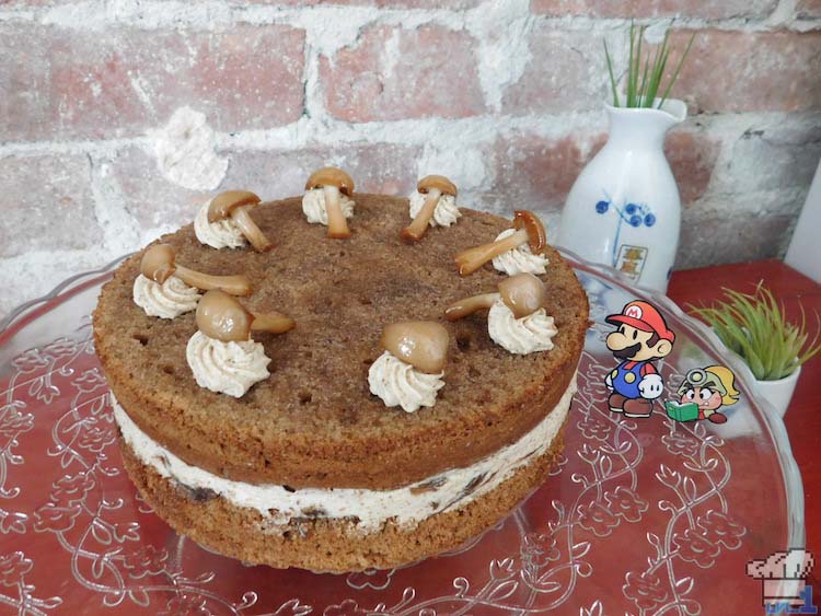 Finished and frosted two layer mushroom Shroom Cake from the Paper Mario Thousand Year Door game series.