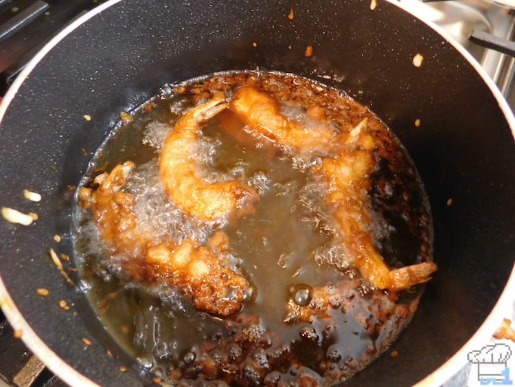 Deep frying the tempura battered shrimp before they are assembled for the Super Shwaffle deep fried waffle recipe from the Splatoon video game series.