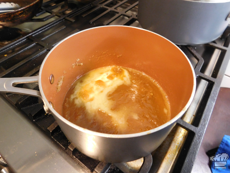 Melting the butter and sugar for the energizing honeyed apple from the Legend of Zelda: Breath of the Wild video game